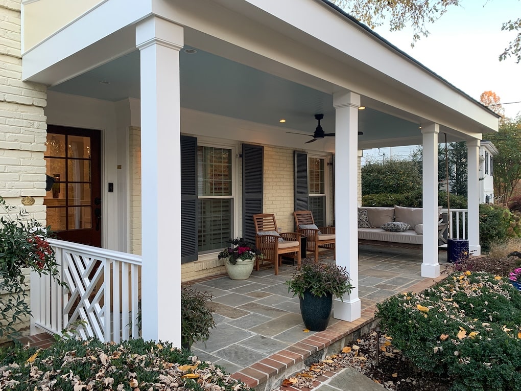 A porch after the addition process with grand white columns