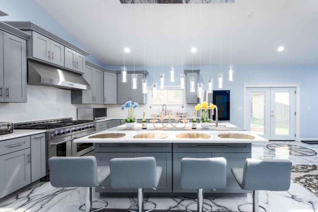 A clean gray and white luxury kitchen remodel