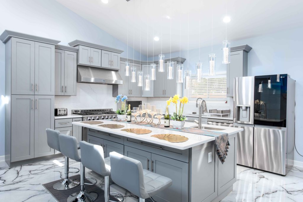 A clean gray and white upscale kitchen remodel